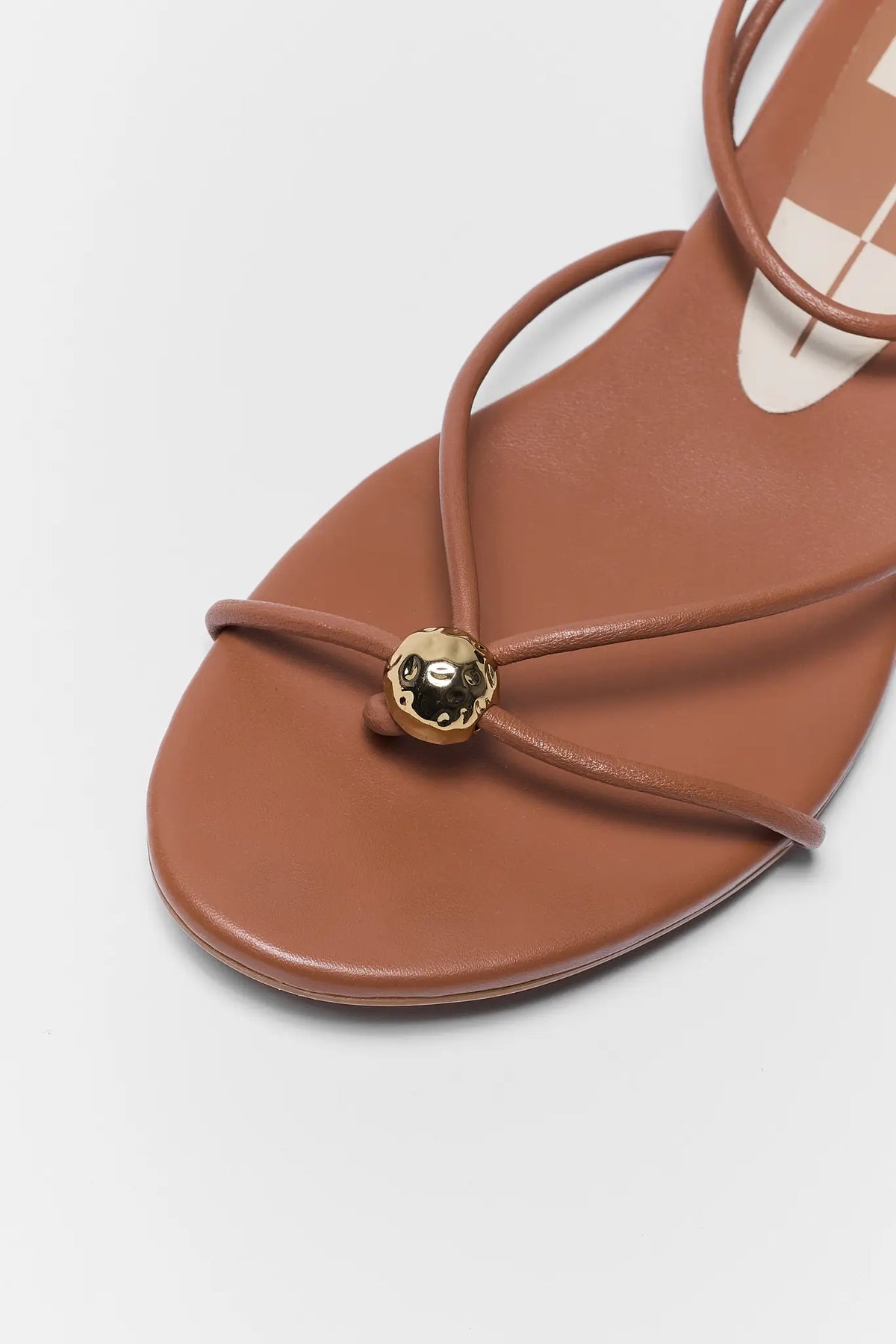 Dolce Vita Kenley brown sandal hammered gold ball toe strap detail - Close-Up Detail | Avara