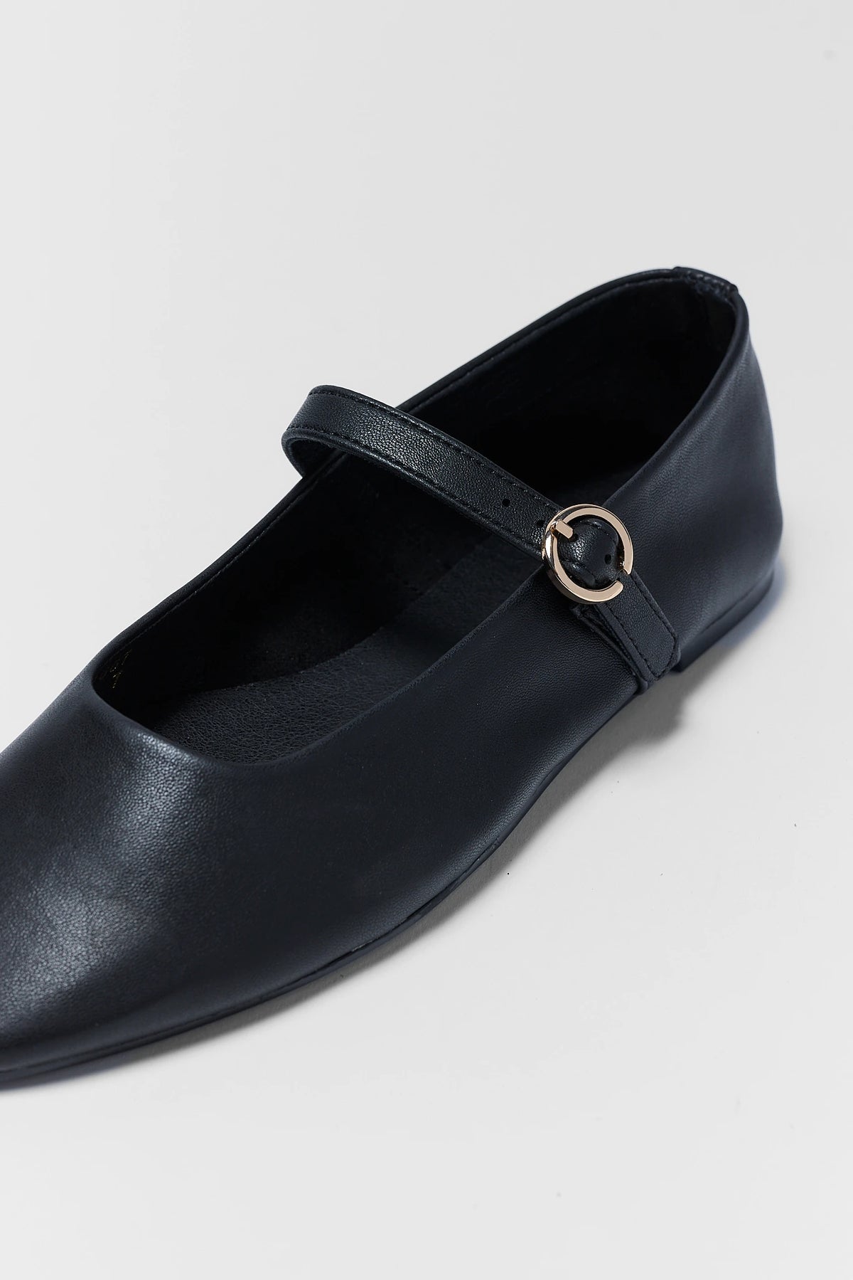 Black Faux Leather Mary Jane Flats - Close-Up Gold Buckle & Square Toe Detail | Avara