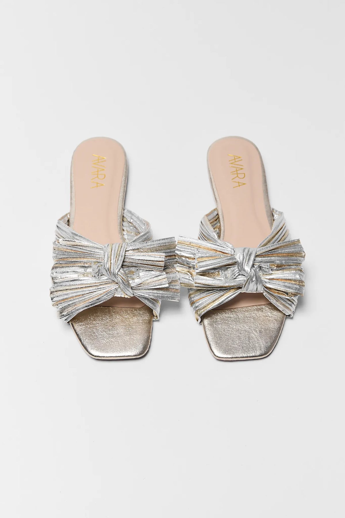 Silver and gold two tone metallic knot sandals - Top Down Flat Lay showing square toe | Avara