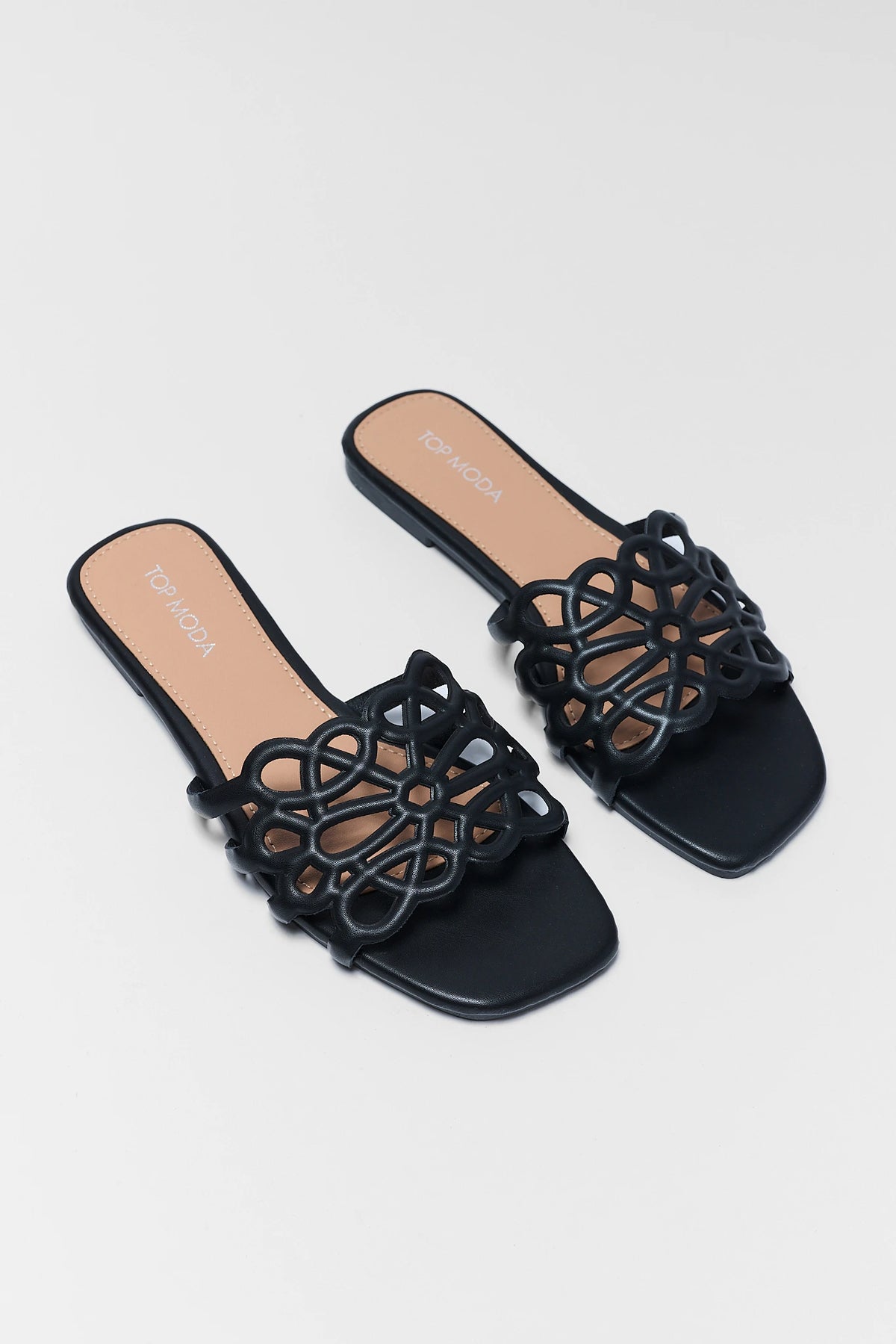 Black faux-leather cutout floral sandals - Front Toe View Pair | Avara