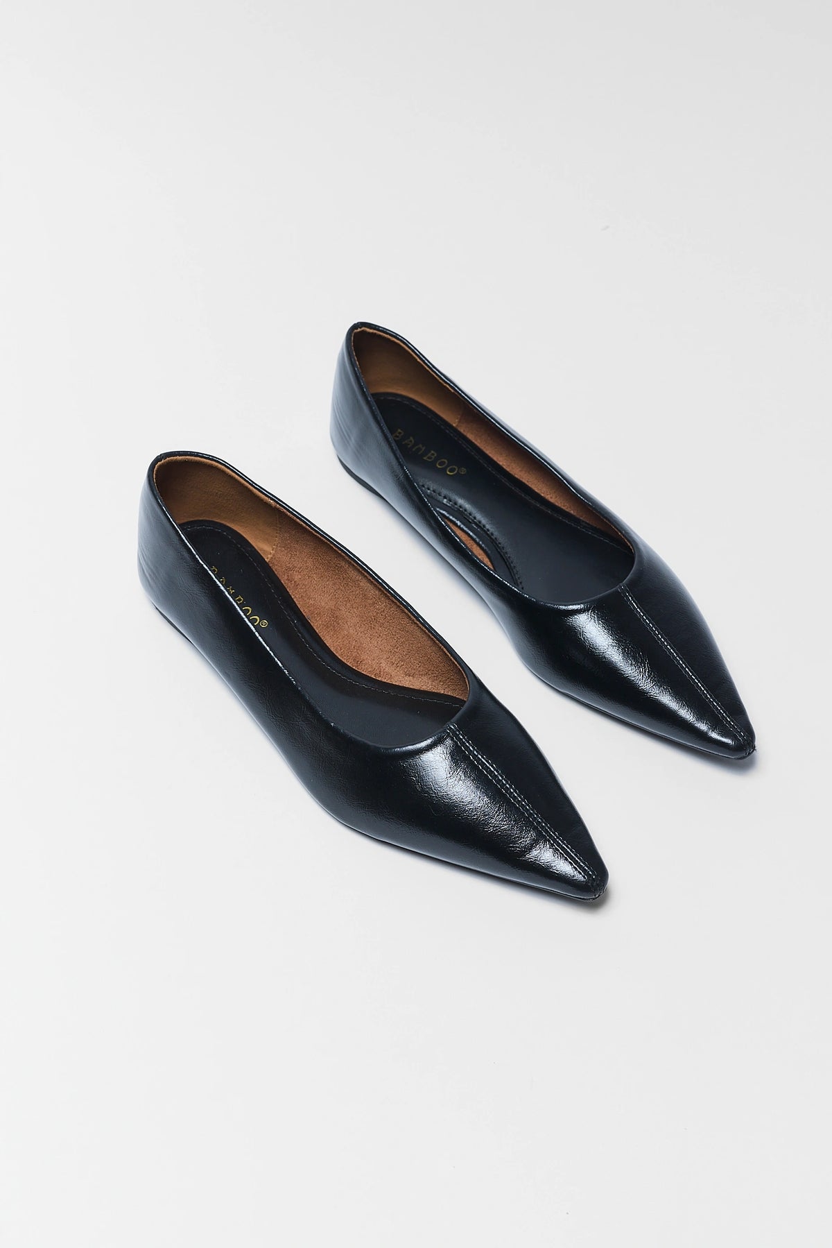 Black Faux Leather Pointed Toe Flats - Angled Pair Flat Lay, Pointed Silhouette Both Shoes | Avara