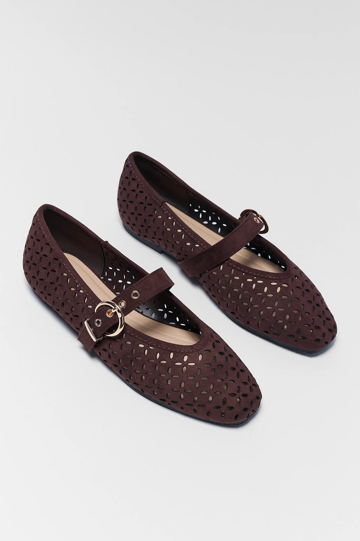 Dark Brown Faux Suede Ballet Flats with cutout pattern and gold buckle strap - Angled Pair View | Avara