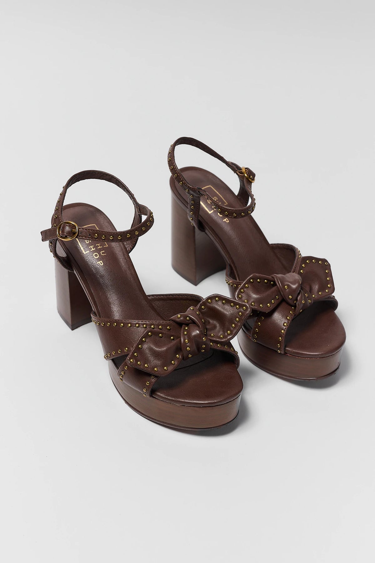 Brown Faux Leather Platform Heel - Pair View with Ankle Strap and Studded Bow Detail | Avara