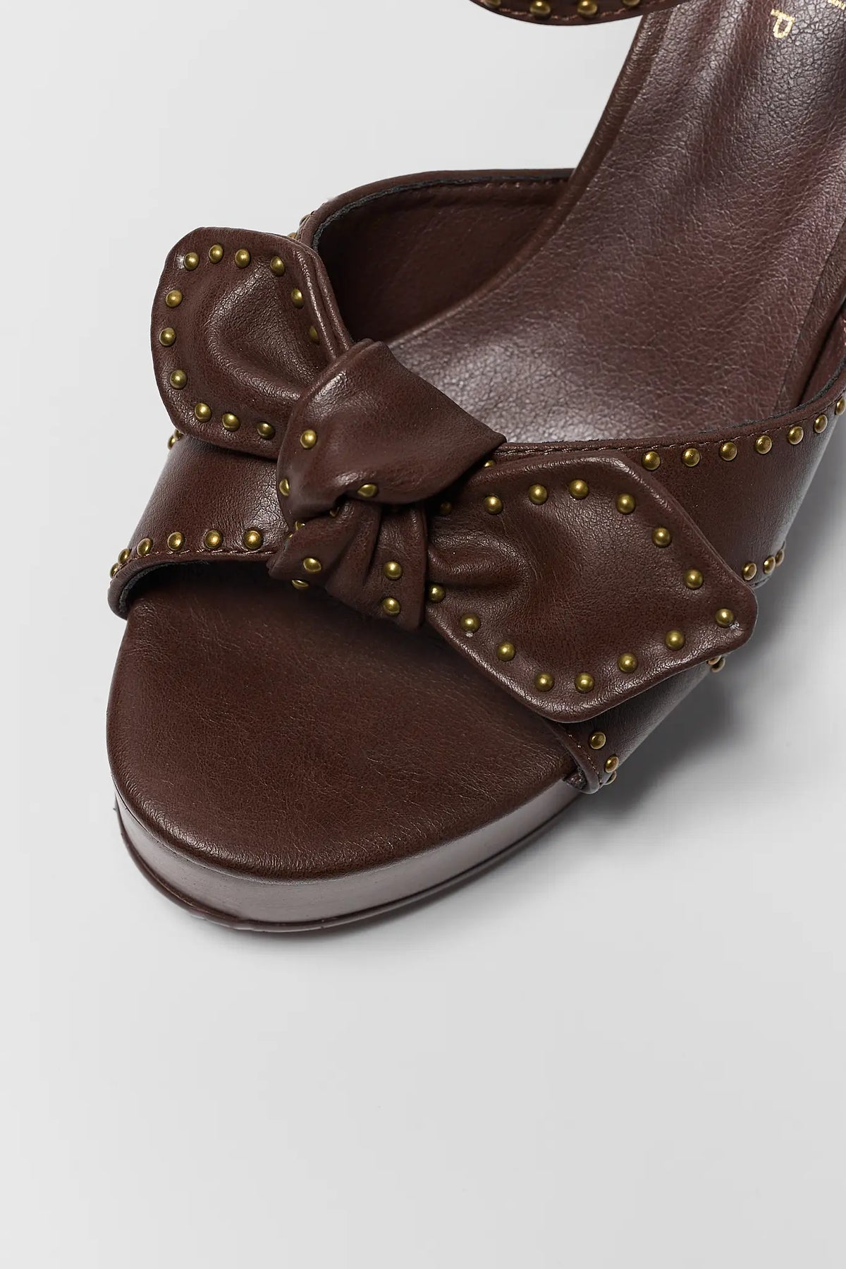 Brown Faux Leather Platform Heel - Toe Box Close-Up with Knotted Bow and Brass Studs | Avara