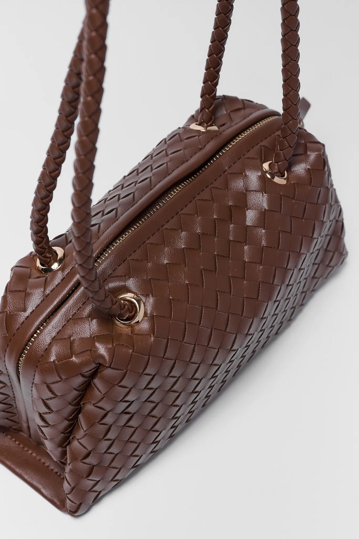 Brown woven faux leather shoulder bag - Close-Up of Gold Hardware and Zip Detail | Avara