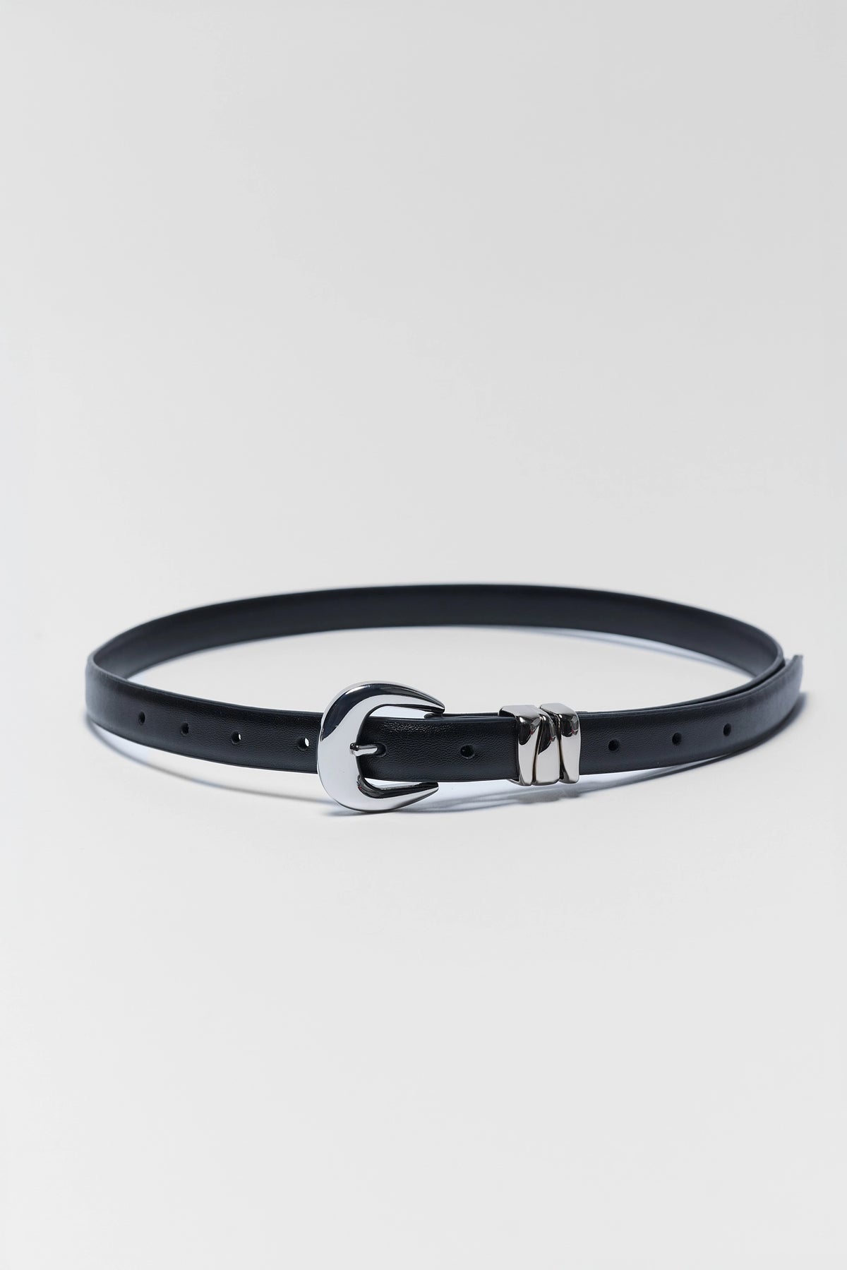 Caroline Black Faux Leather Keeper Belt with silver-tone buckle and keeper detail, oval flat lay | Avara
