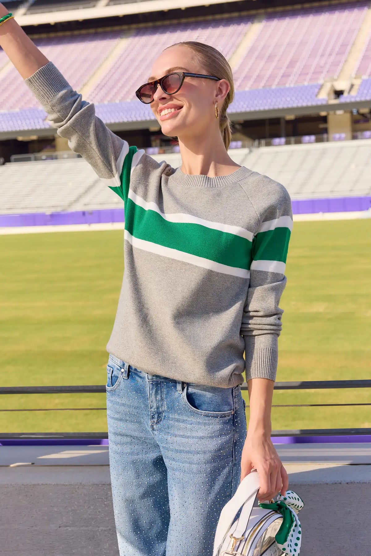 Dylan Green Stripe Sweater with jeans and clear stadium bag - Game Day Styled Look | Avara