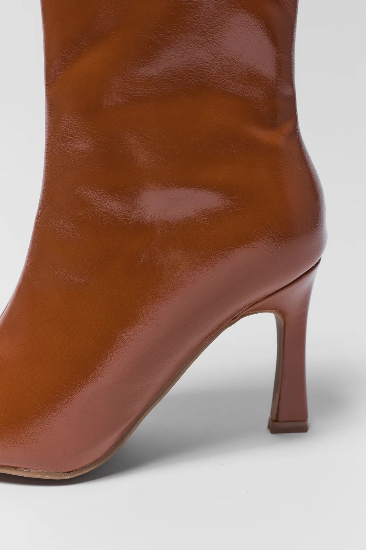 Brown Faux Leather Ankle Boot Heel and Toe Close-Up Detail | Avara