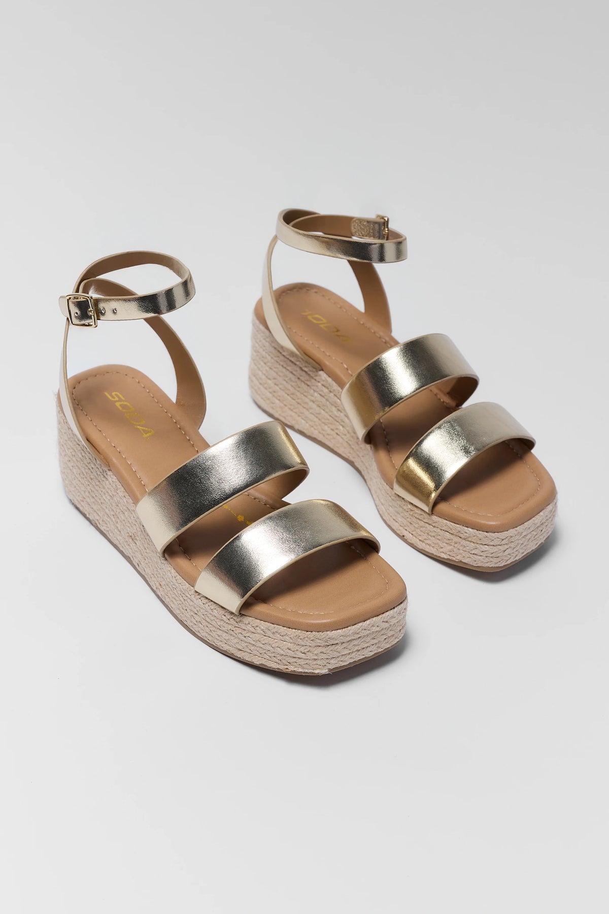 Gold metallic braided wedge sandals pair - Front Angle View | Avara