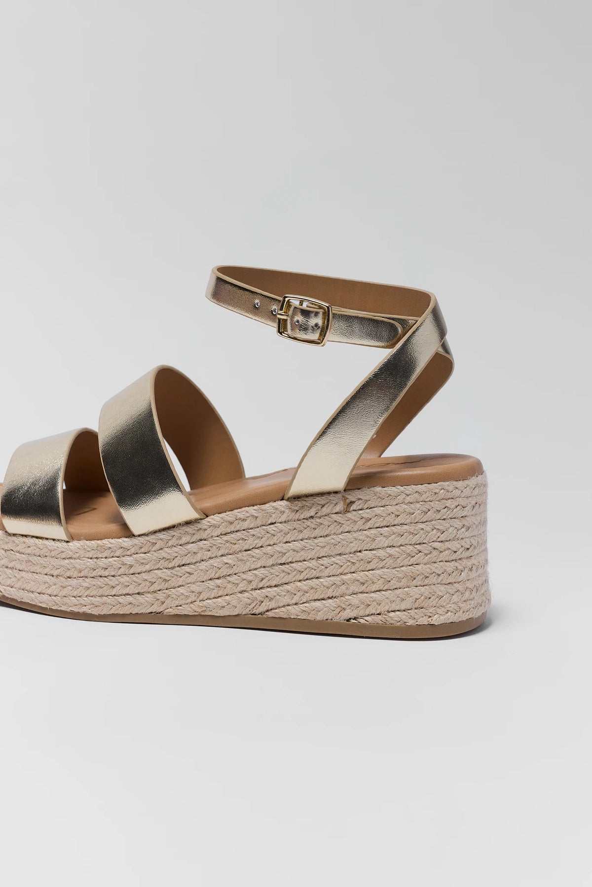 Close-up of gold braided wedge sandal ankle strap buckle and jute platform detail | Avara