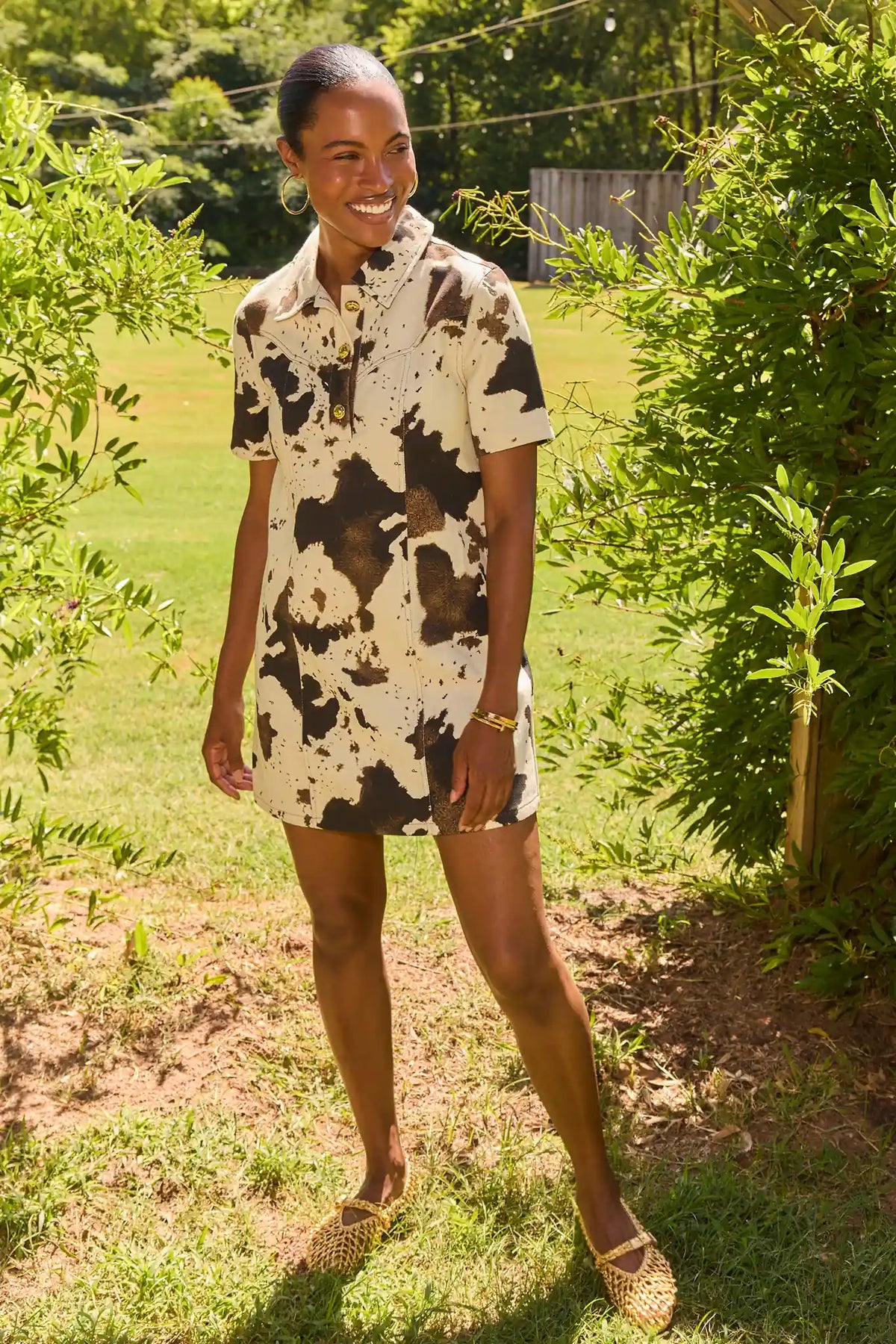 Ivory Cow Print Short Dress - Outdoor Lifestyle Shot, Sunny Garden Setting | Avara