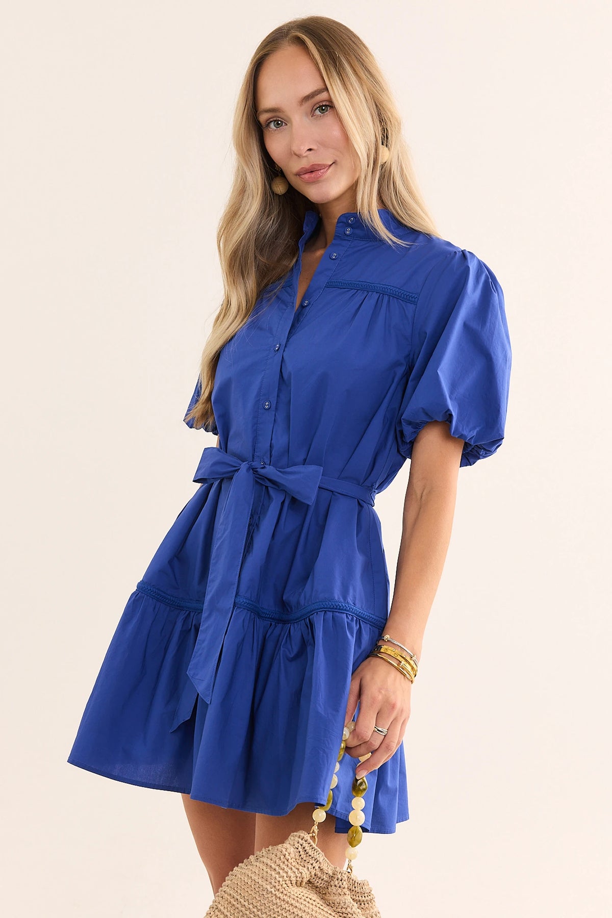 Jane Navy Puff Sleeve Short Dress with woven bag and gold jewelry - Lifestyle Side View | Avara