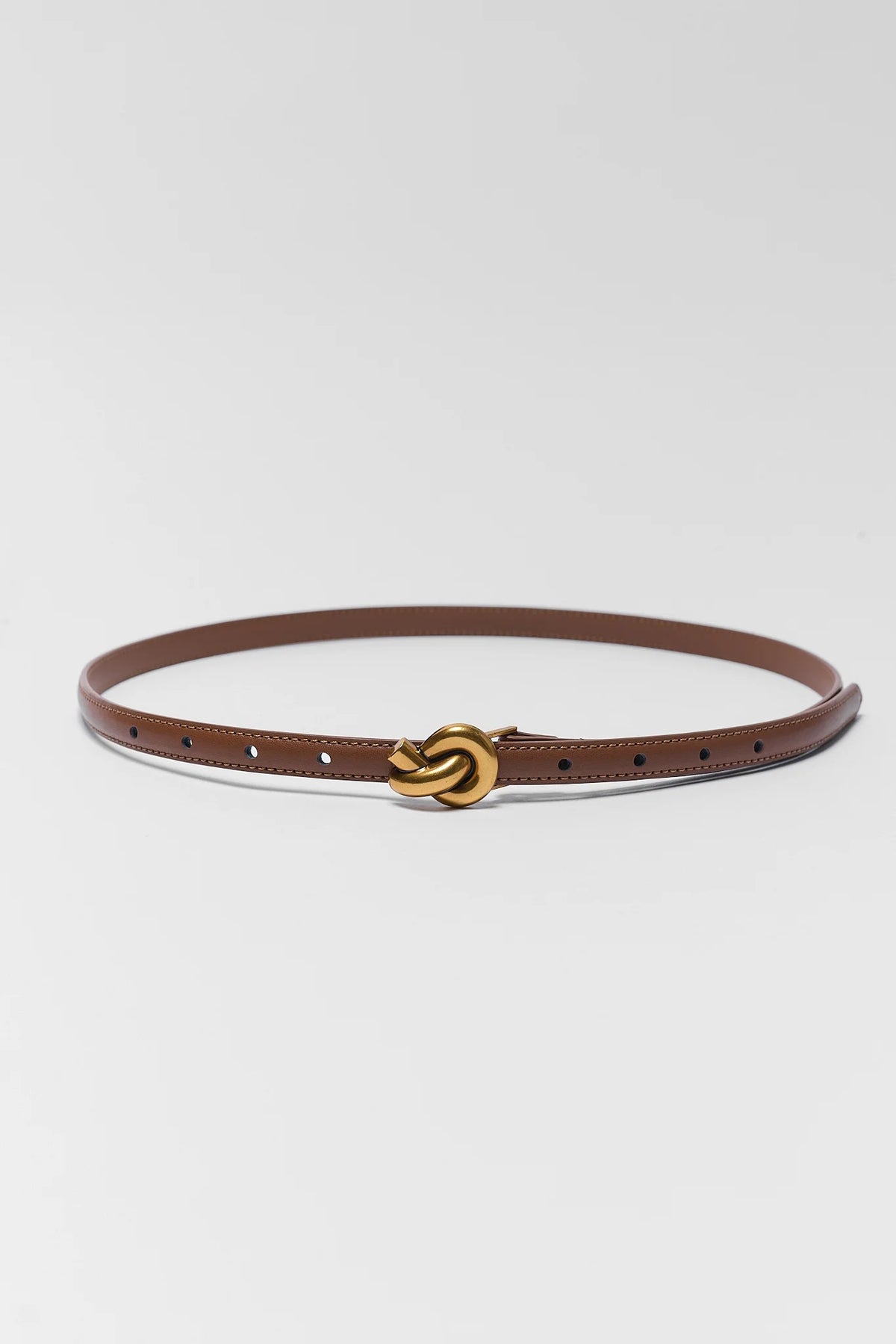 Brown faux leather skinny knot belt with gold-tone buckle, laid flat - Full Length View | Avara