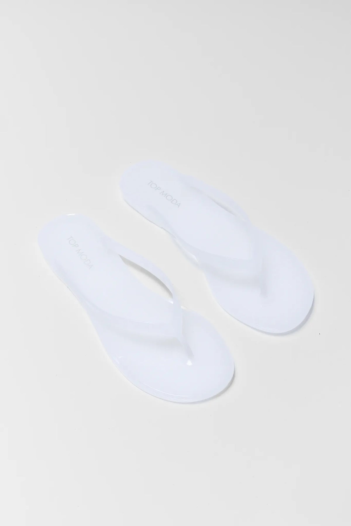 Kathy White Jelly Flip Flop Sandals - Overhead Angled Pair View | Avara