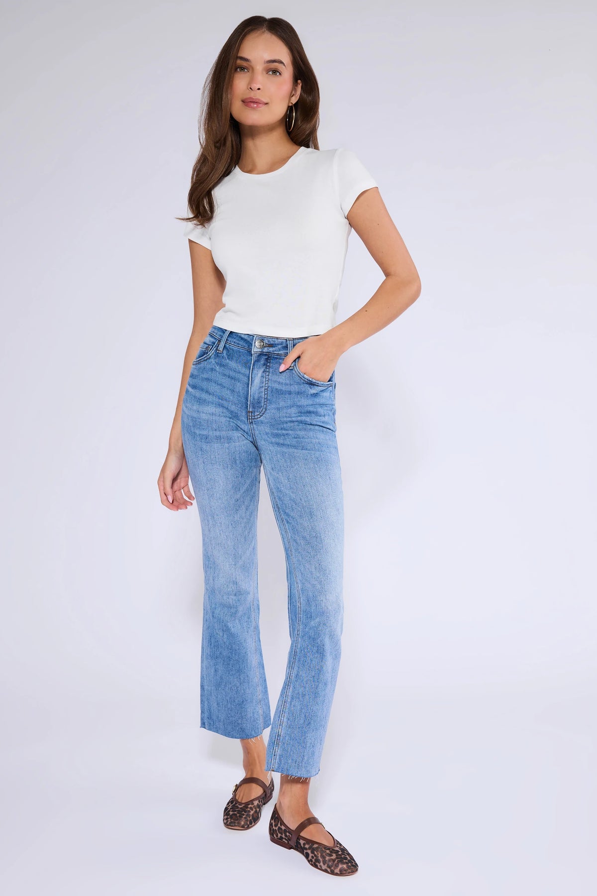 Kelsey Medium Wash Kick Flare Jeans - Full Front View, styled with white tee and leopard flats | Avara