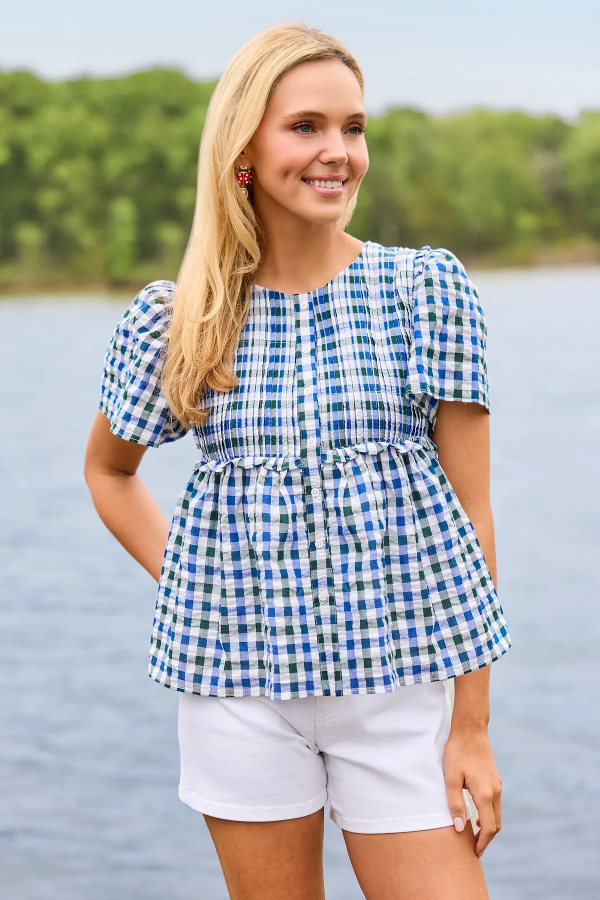 Libby navy gingham peplum top styled with white shorts - Outdoor Lifestyle Shot | Avara
