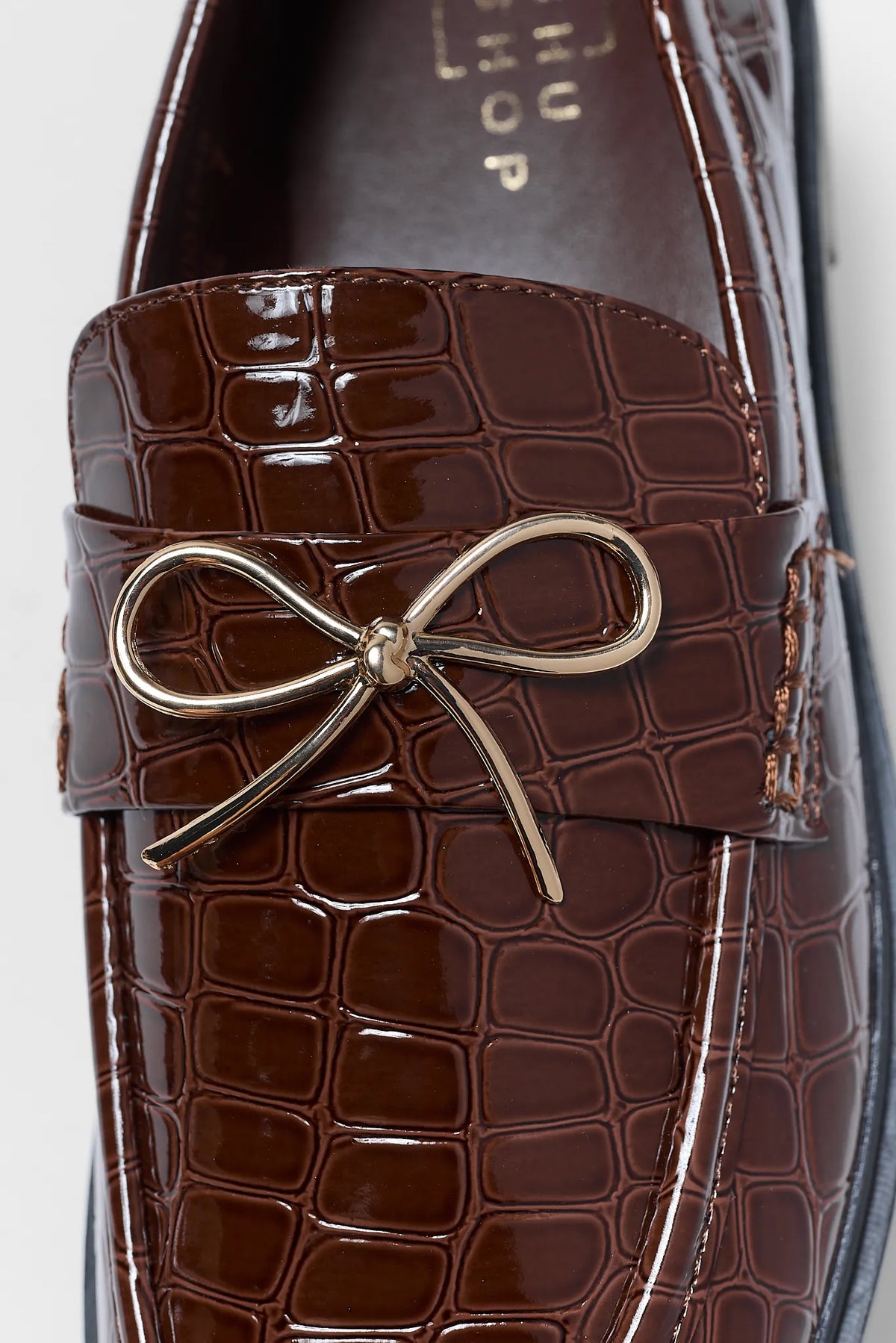 Brown Faux Leather Loafer - Gold Bow Hardware Close-Up Detail | Avara