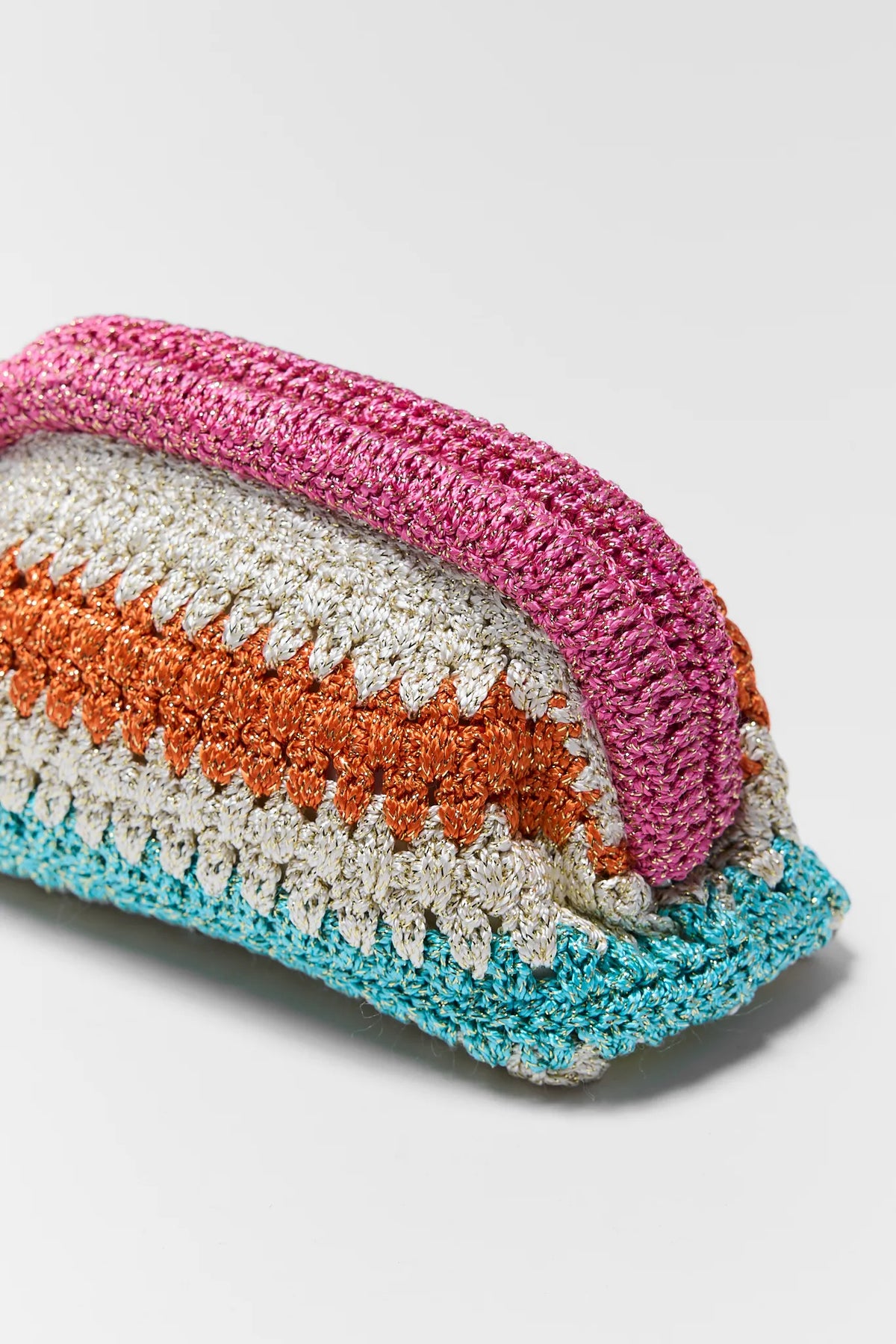 Luna Multicolor Woven Clutch Angled Close-Up, Metallic Pink Orange Teal Crochet Detail | Avara