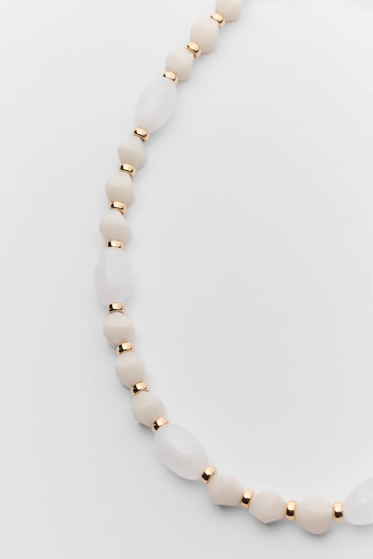 Maris Ivory Bead Necklace close-up showing oval ivory beads and gold rondelle spacers - Bead Detail | Avara