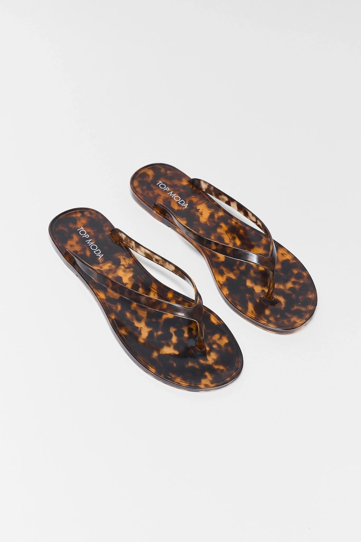 Marley Tortoise Jelly Sandals pair top-down view showing tortoise shell print footbed and thong strap | Avara