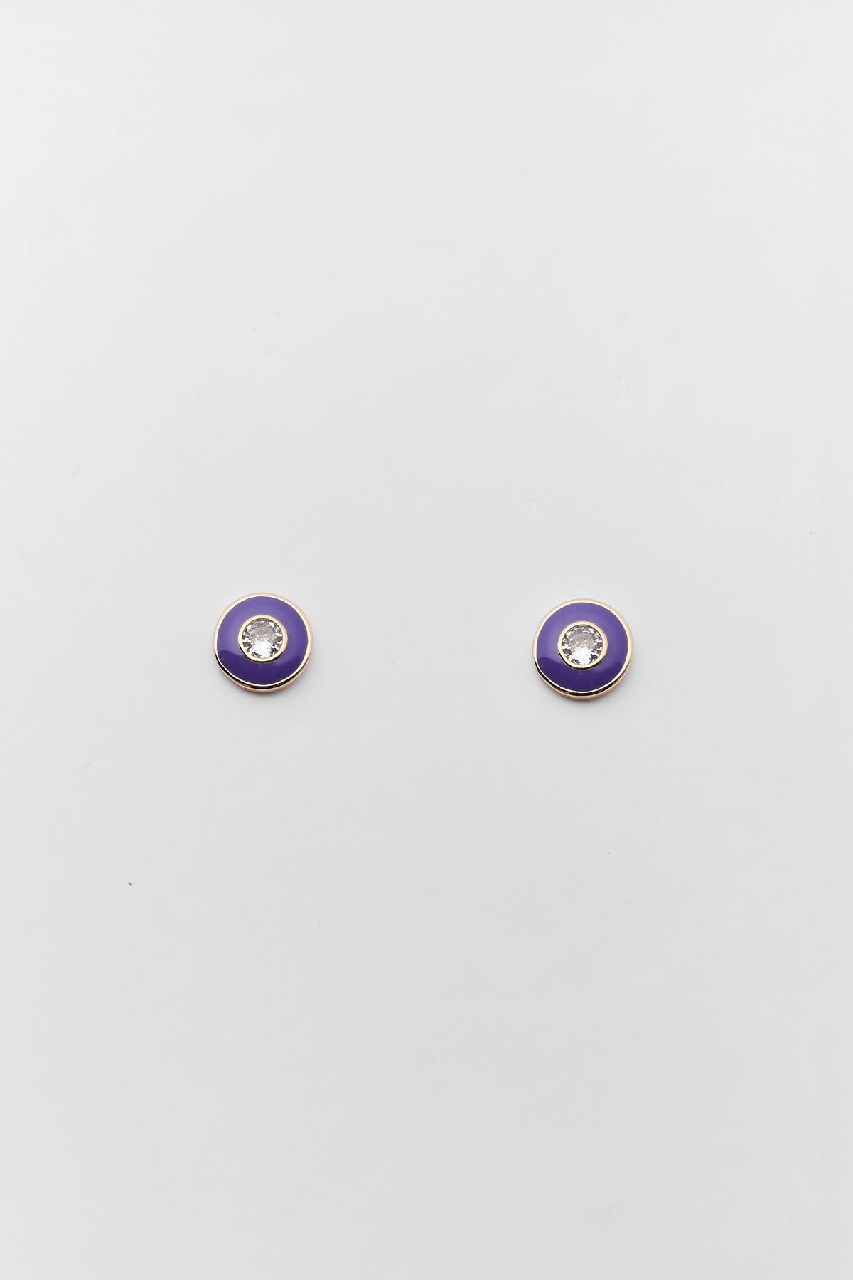 Purple enamel rhinestone stud earrings with gold-tone bezel and crystal center - Flat Lay | Avara