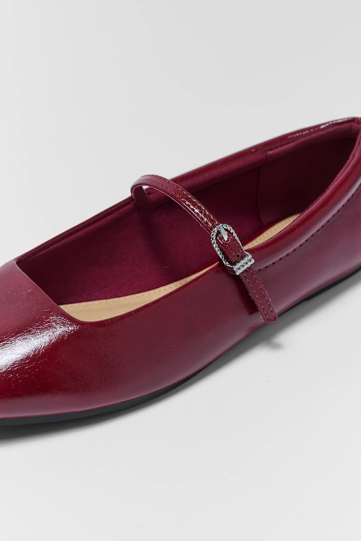 Red Patent Flats - Close-Up Buckle Strap and Round Toe Detail | Avara