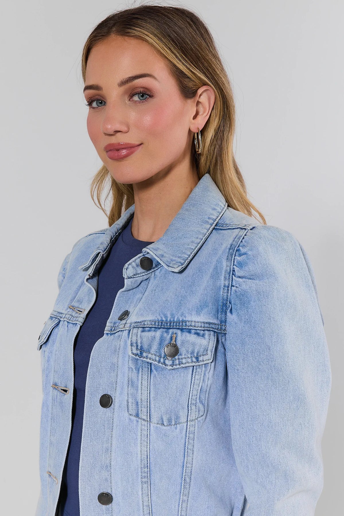Roxanna Light Wash Denim Jacket - Puff Shoulder & Chest Pocket Close-Up, On Model | Avara