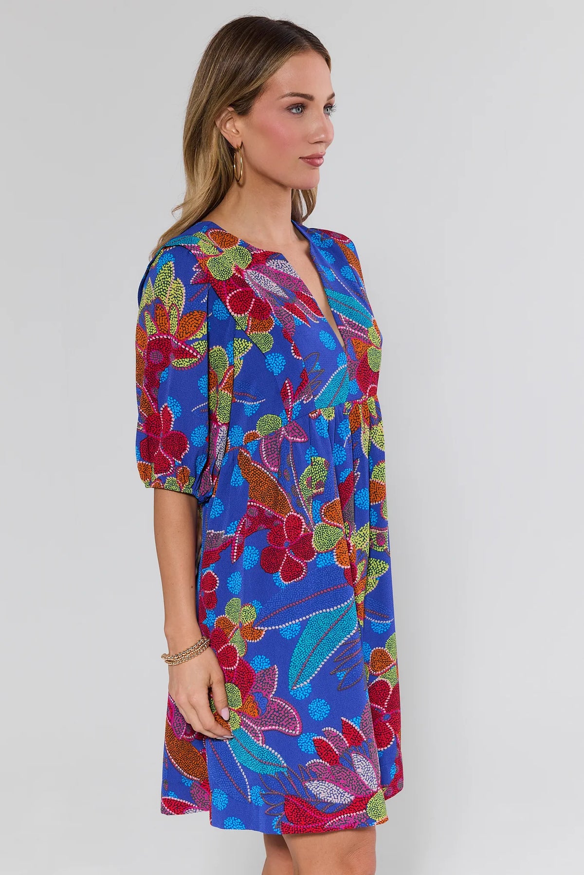 Rita Blue Floral Print Short Dress, side profile view, balloon sleeve detail, women's short dress | Avara