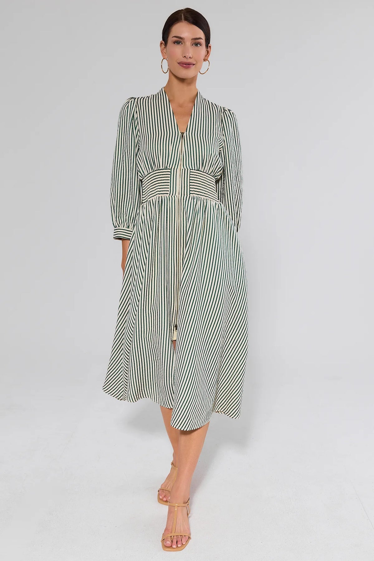 Full body front view of green striped Brantley Midi Dress with 3/4 sleeves and flowy A-line skirt | Avara
