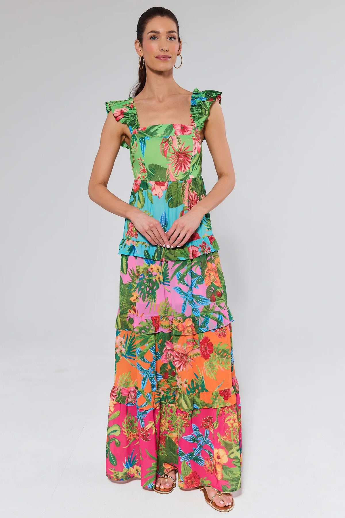 Woman wearing a colorful dress on a white background