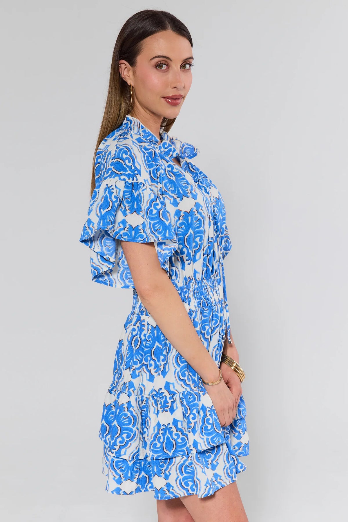 Ellianna Blue Short Dress side profile showing tiered ruffle hem and flutter sleeves | Avara