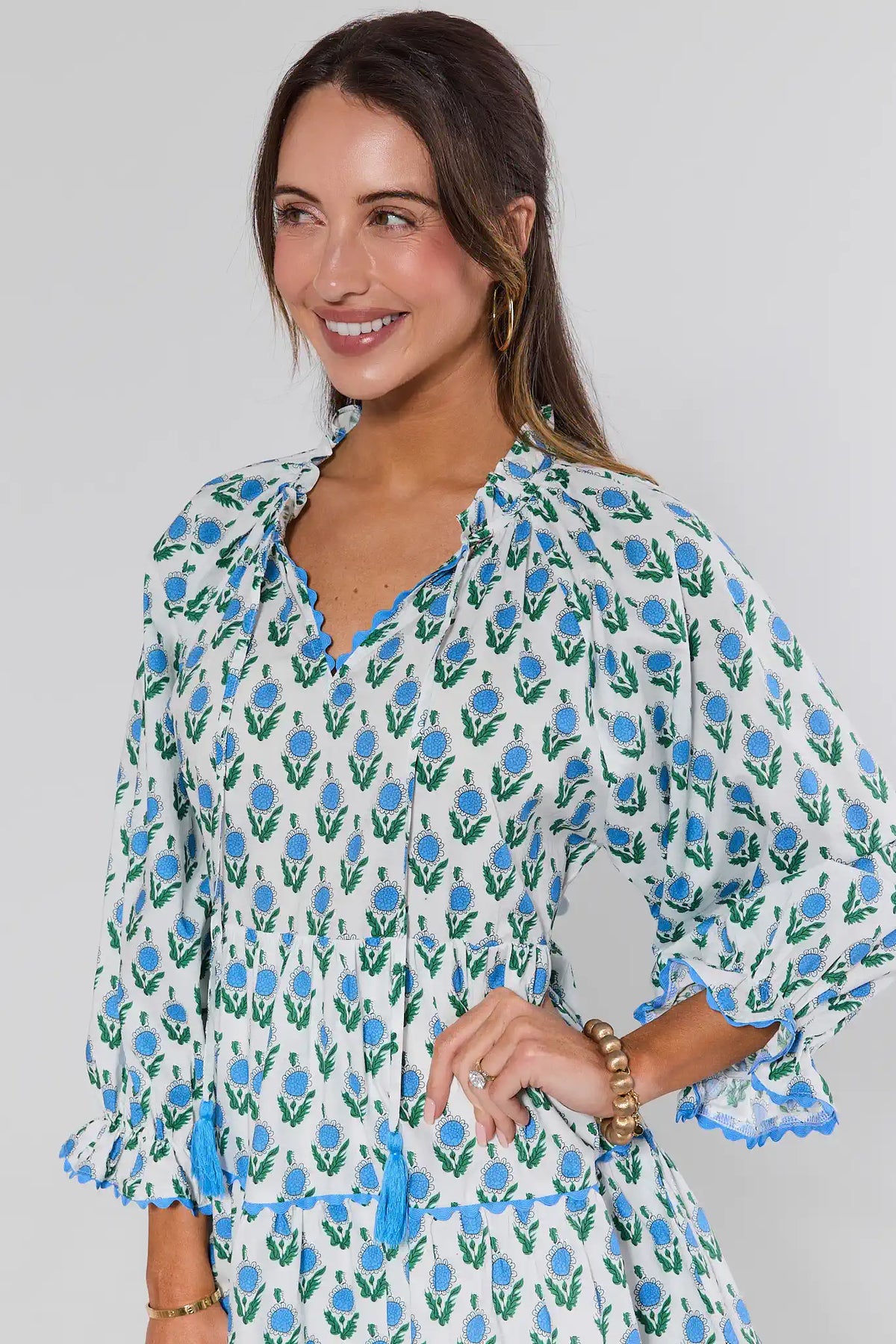 Camilla Blue Floral Print Short Dress - Close-Up, ruffled V-neckline and tassel detail | Avara