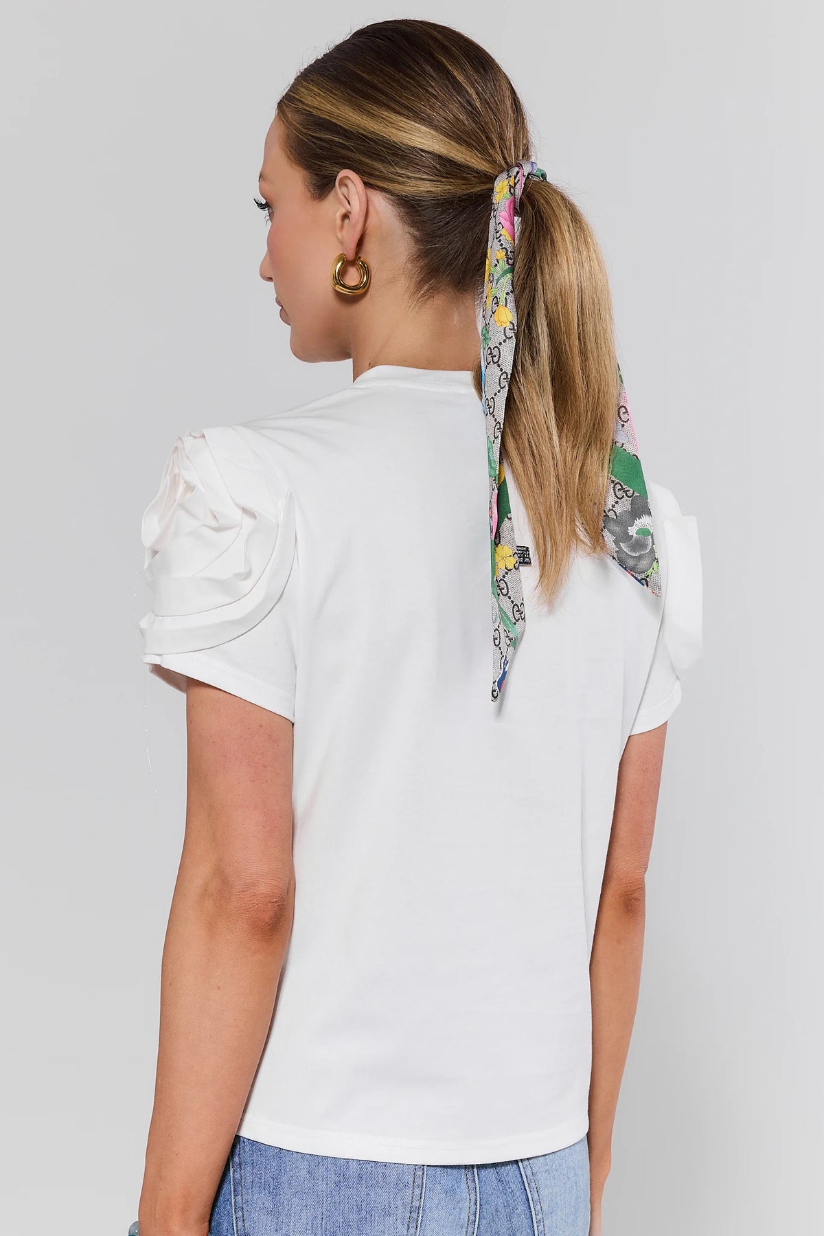 Kendall White Floral Appliqué Top back view showing clean silhouette and ruched rose sleeve detail | Avara