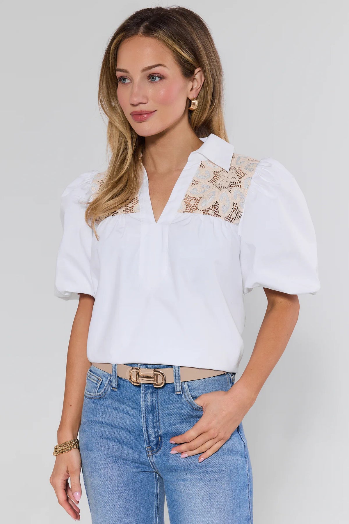 White crochet lace top with puff sleeves and floral yoke inset, on-model front angle styled with jeans | Avara