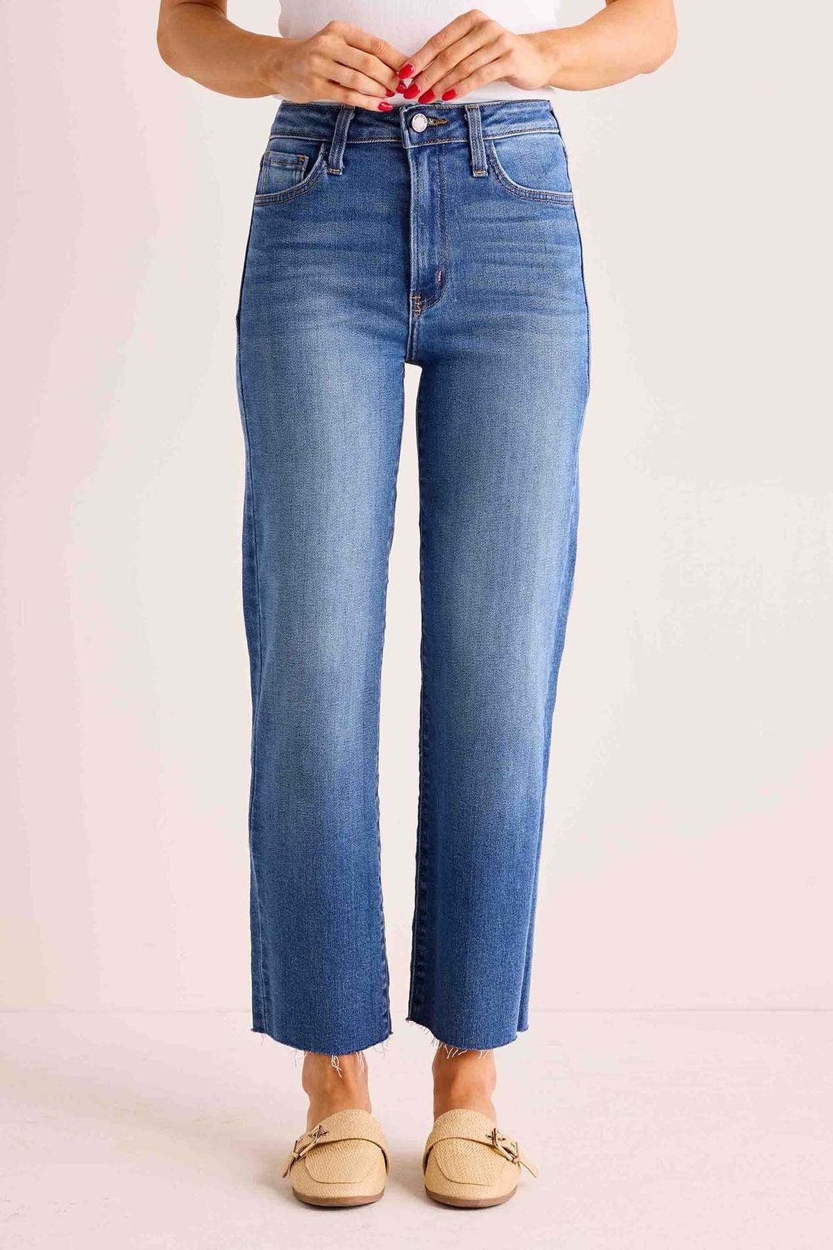 Melanie Medium Wash Straight Leg Jeans with frayed hem and high-rise fit, paired with tan loafers and white top - Front View | Avara