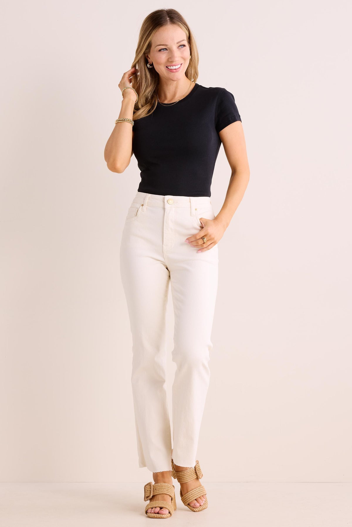 Aria Black Fitted Tee - Full Length On Model, Styled with White Jeans & Sandals | Avara
