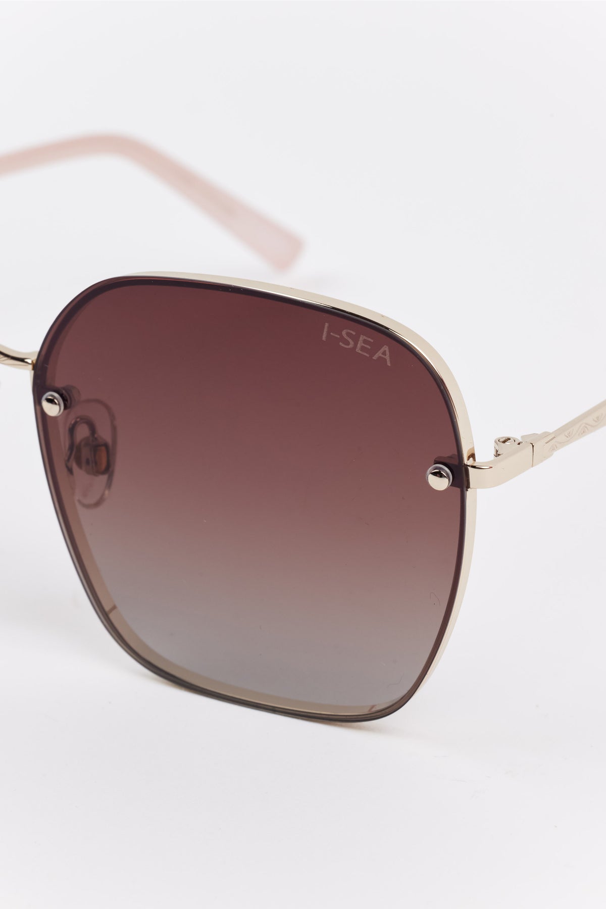 Emerson Round Polarized Sunglasses featuring a gold metal frame with gradient brown lenses, etched with I-SEA, adjustable nose pads, and capped earpieces.