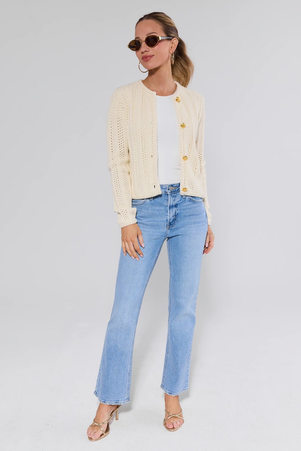 Laurel Light Wash Kick Flare Jeans styled with cream cardigan and white tee - Full Length On Model | Avara