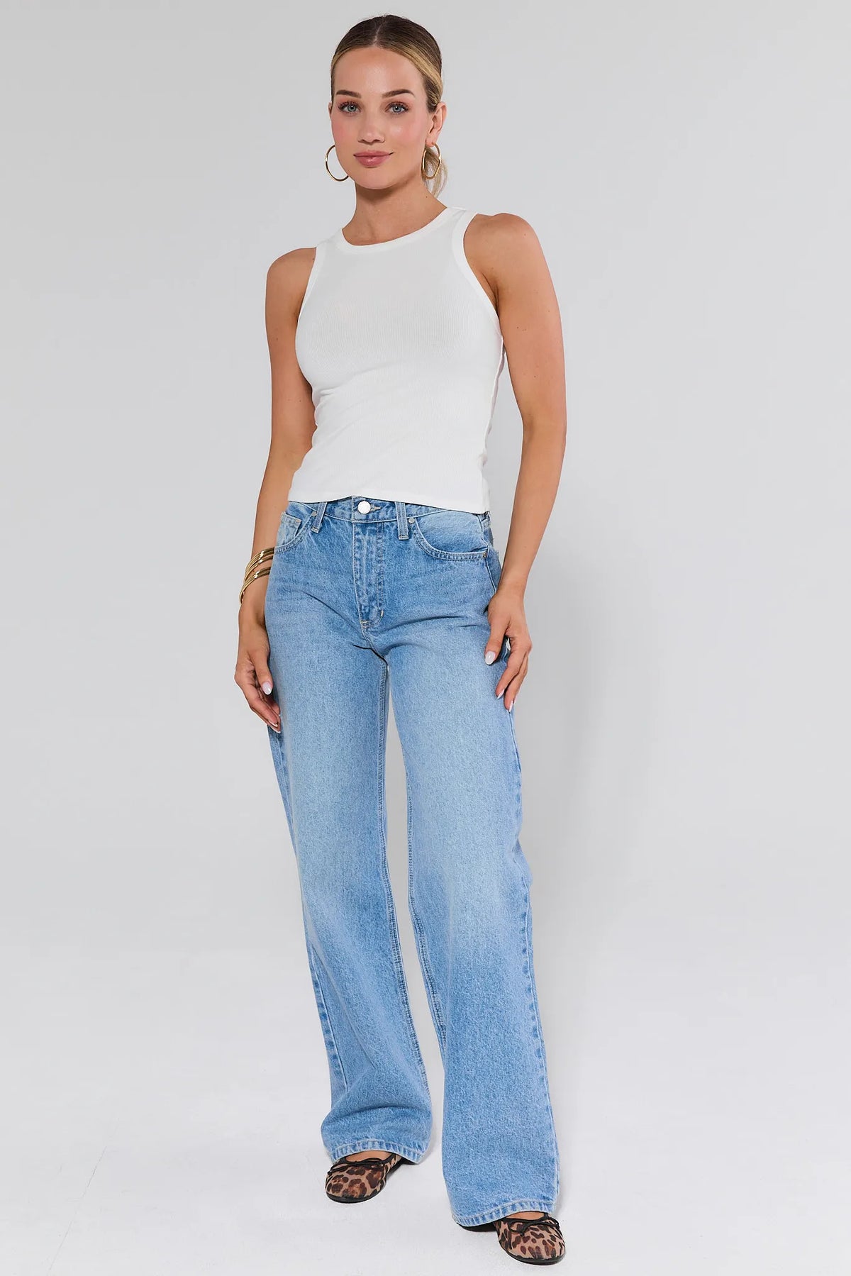 Allie White Ribbed Tank Top - Full Length Styled Look, plain white tank top tucked into wide-leg light blue jeans | Avara