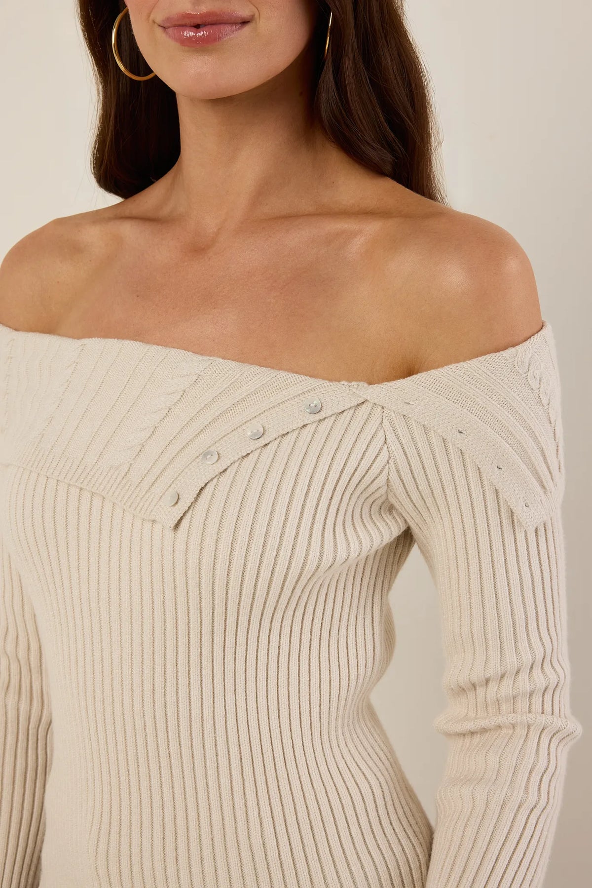 Ashlyn Ribbed Knit Top close-up showing fold-over off-shoulder neckline with pearl button detail - Neckline Detail | Avara