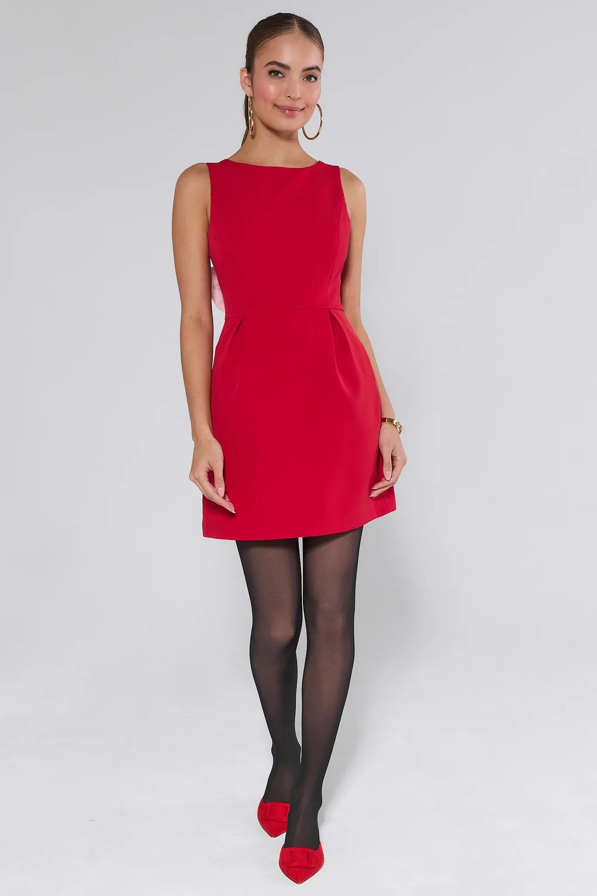 Red Nina Bow Mini Dress - Full Front View On Model with Black Tights | Avara