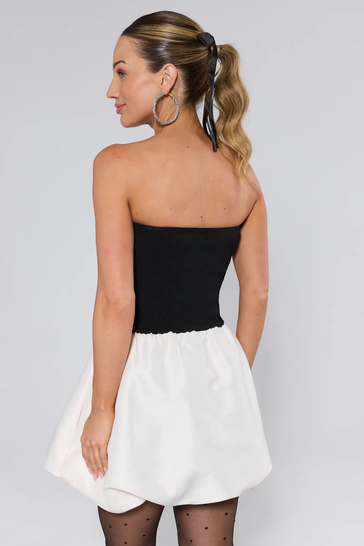 Sasha Strapless Bubble Mini Dress black ribbed top, white bubble skirt, polka-dot tights - Back View | Avara