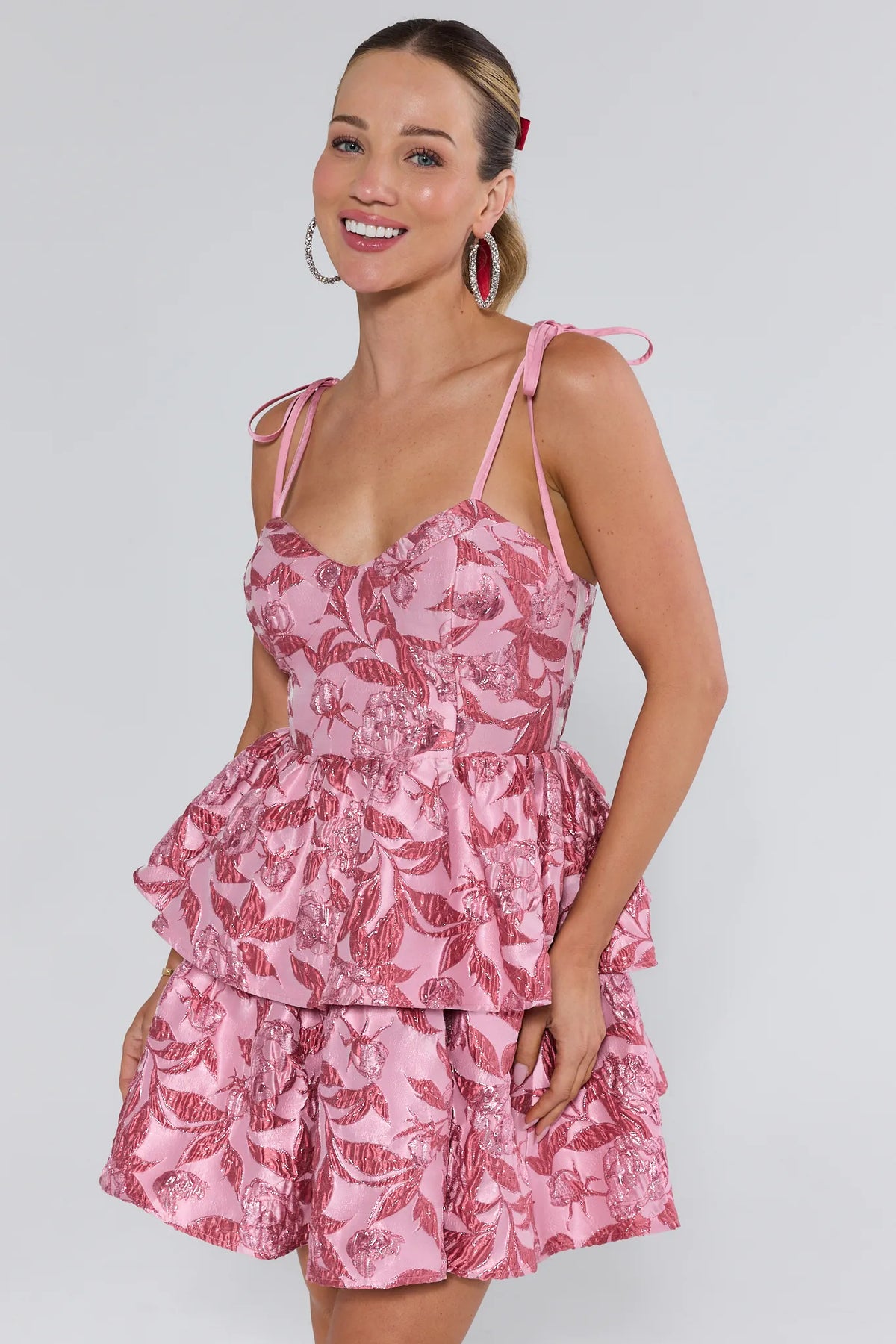 Pink Metallic Floral Brocade Mini Dress with Tie Straps and Tiered A-Line Skirt - Front View | Avara