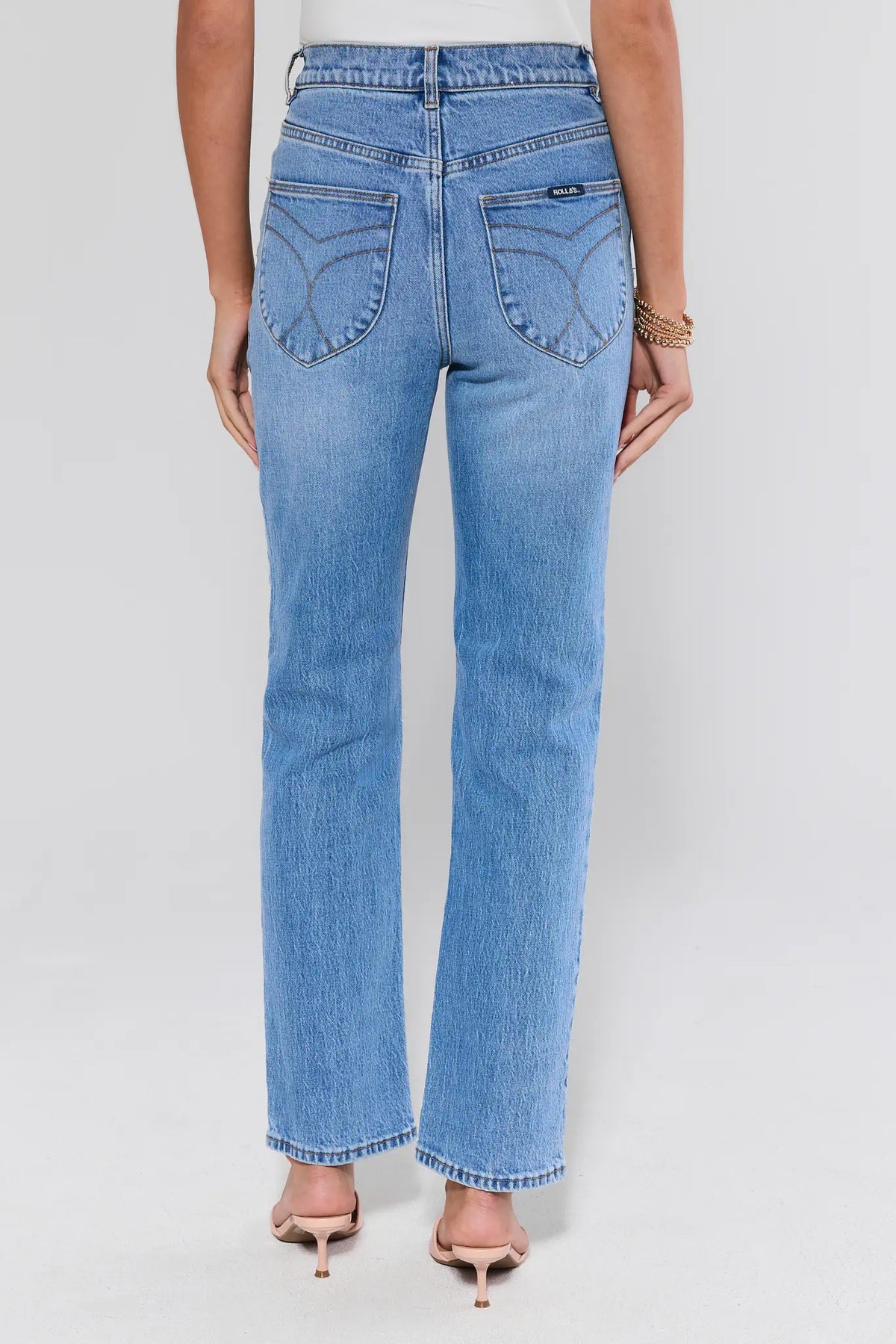 Rolla's Lou Light Wash Straight Leg Jeans back view, showing curved pocket stitching and high-rise waist | Avara