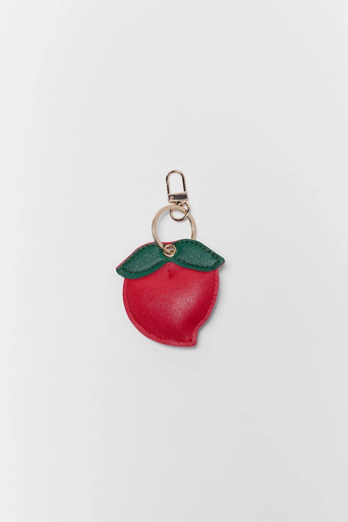 Red Faux Leather Peach Shape Bag Charm with Gold-Tone Key Ring - Flat Lay | Avara