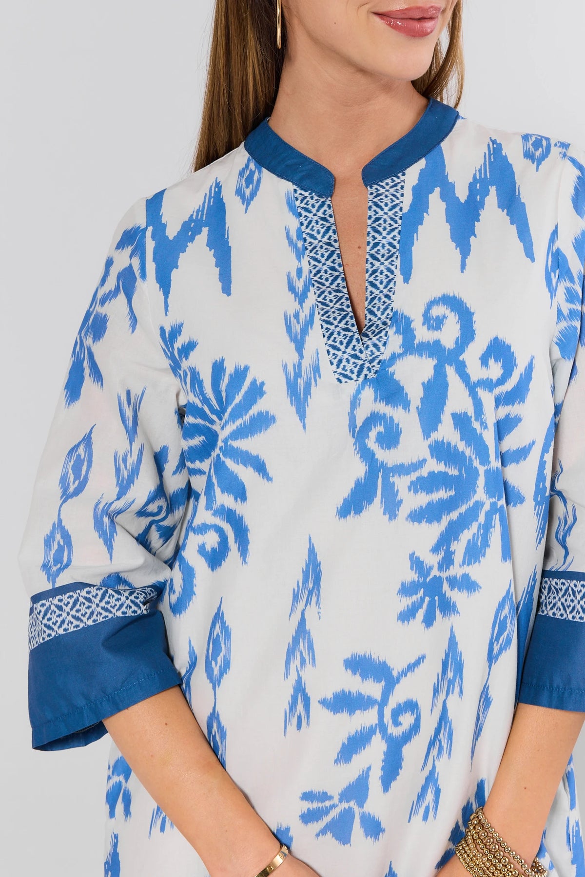 Priscilla Blue Printed Tunic Dress split neckline and contrast trim close-up detail | Avara