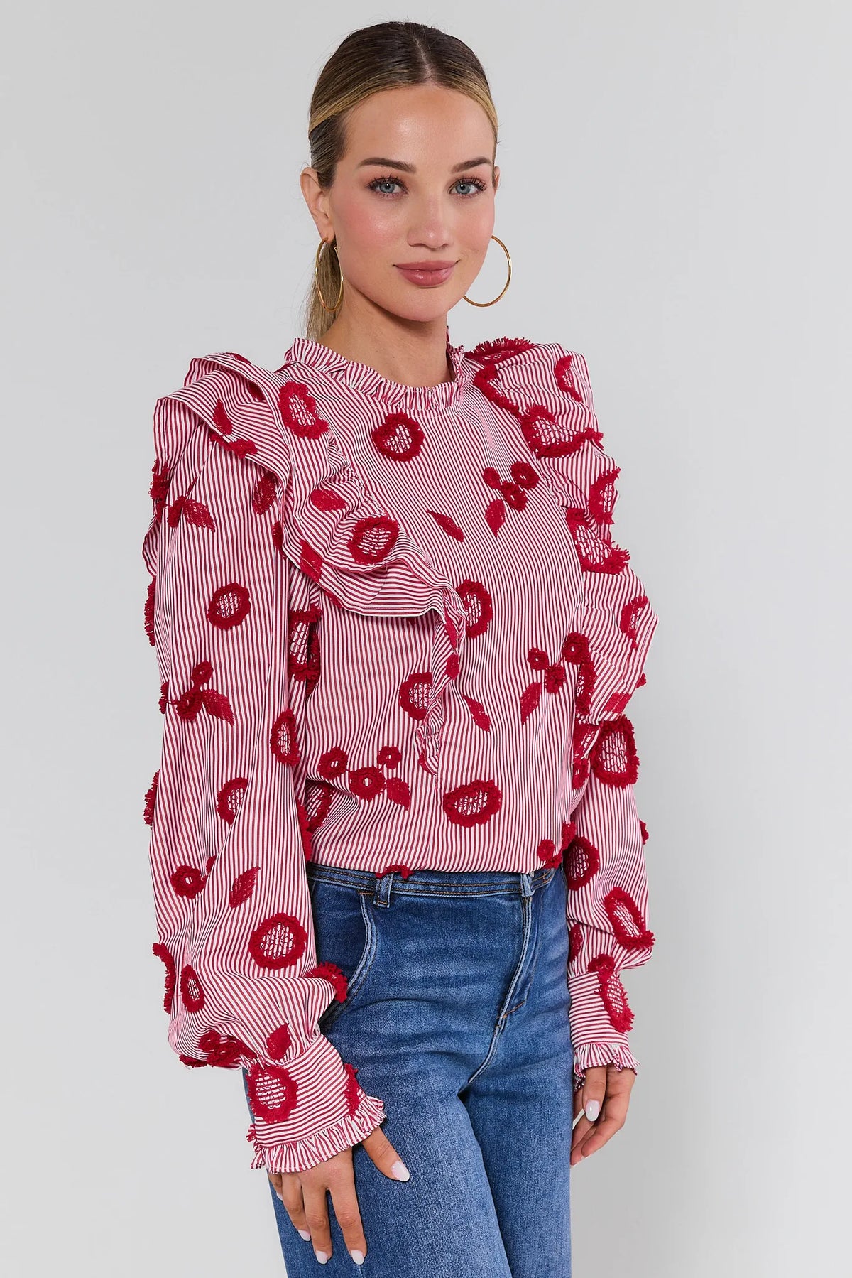 Red striped floral ruffle top with embroidered blooms and long sleeves - Side Angle On Model | Avara