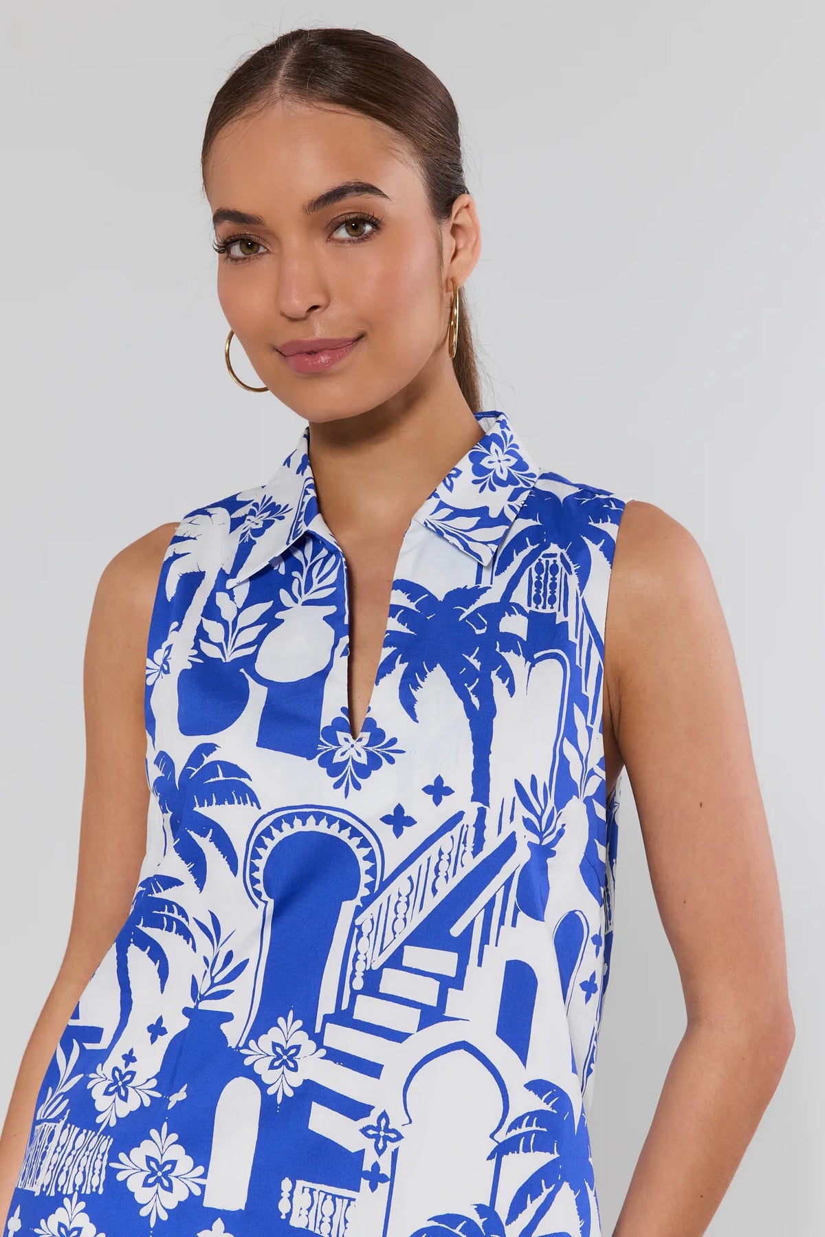 Close-up of blue Moroccan print dress collared neckline and palm tree pattern detail | Avara