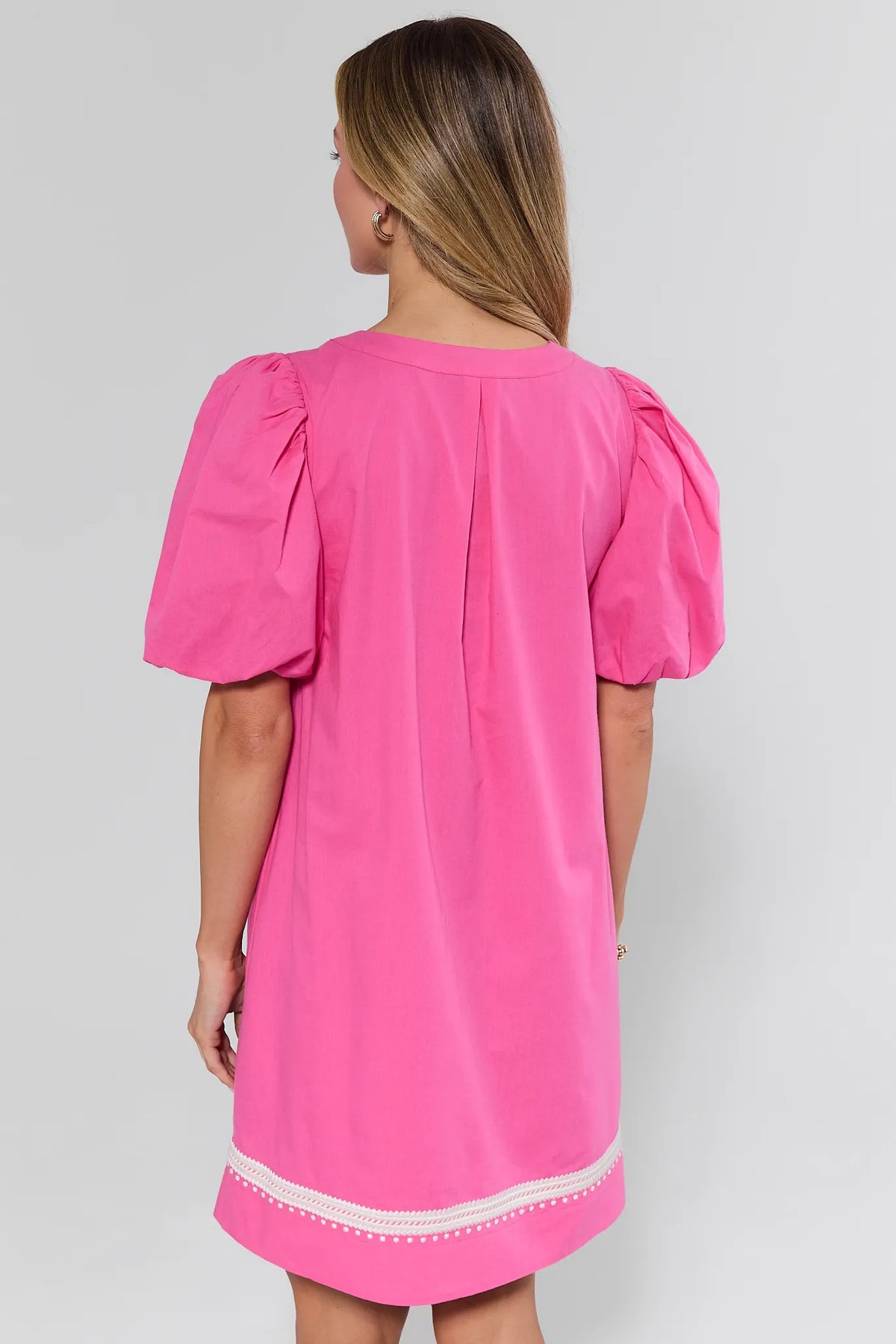 Pink puff sleeve short dress with white embroidered hem trim - Back View | Avara