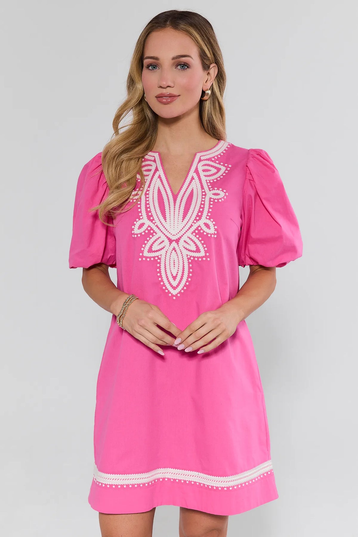 Pink embroidered short dress with puff sleeves and white floral neckline detail - Front View | Avara